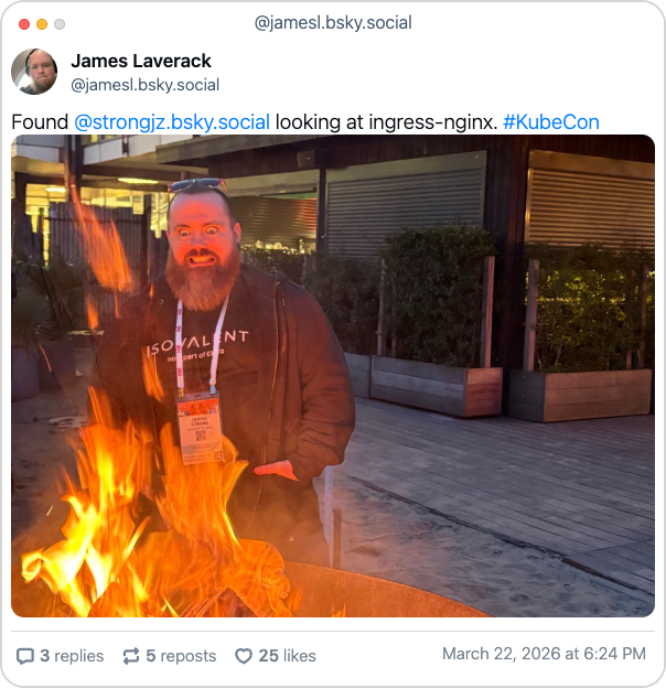 Bluesky post from James Laverack with the following text: "Found @strongjz.bsky.social looking at ingress-nginx. #KubeCon" Below is a photo of James Strong grinning behind a bonfire.